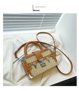 Detail of a brown woven box bag featuring premium leather trim and silver metal corners