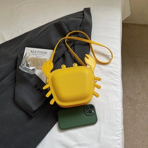Unique bright yellow crab-shaped shoulder bag in pebble grain faux leather for women