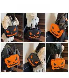 Detailansichten der großen Kürbis-Tragetasche in Schwarz und Orange an einem Model
