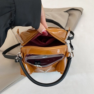 Brown patent leather cartoon car handbag with transparent PVC window and black cat detail