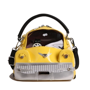 Creative yellow vintage car handbag in glossy patent leather with black cat window detail