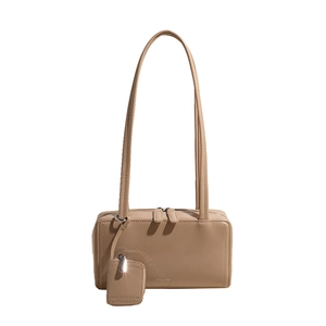 Minimalist beige leather underarm bag with double straps and small hanging coin pouch