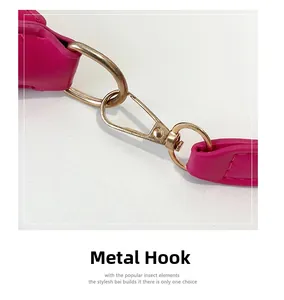 Detail of fuchsia leather shoulder strap with high-quality golden lobster clasp hardware