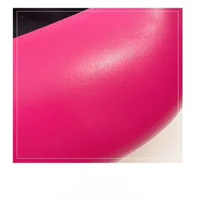 Detailed macro shot of premium fuchsia faux leather texture with soft glossy finish