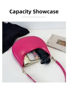 Interior storage capacity of the rose pink crescent shoulder bag with essentials
