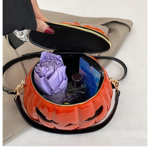Interior view showing large capacity of the glossy pumpkin bag for daily essentials