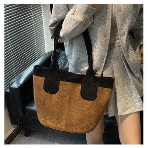 Retro contrast color suede tote bag shown on shoulder for a minimalist summer look