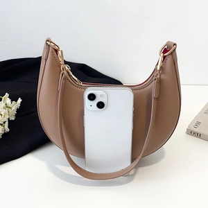 Chic khaki half-moon hobo bag in faux leather with gold hardware and phone size reference