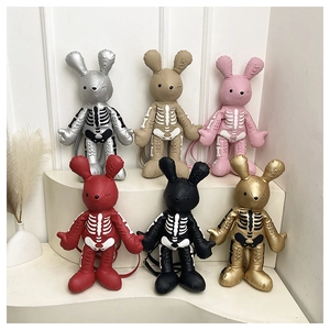 Detailed row of rabbit skull crossbody bags in multiple colors with bone prints