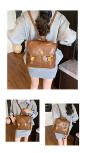 Detailed close-up of brown PU leather backpack with vintage metal buckles and textures