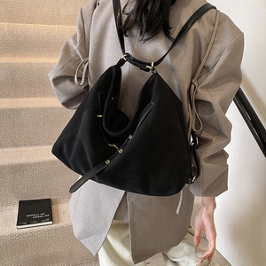 Minimalist black matte suede shoulder bag with adjustable straps for women's commuting