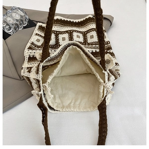 Detail of crochet knit tote bag showing drawstring lining and woven pattern textures