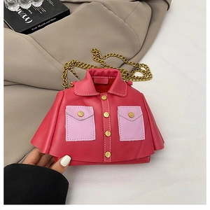 Detail of red leather jacket shaped mini bag with gold buttons and chain strap