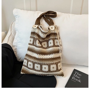 Detail of bohemian crochet tote bag featuring brown and cream striped knit textures