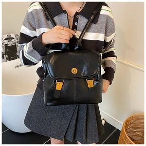 Classic black faux leather backpack with gold buckle closure and decorative side straps