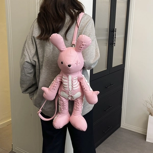 Pink gothic bunny backpack with white skeleton print and decorative cross stitching