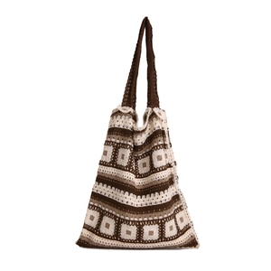 Bohemian crochet tote bag with geometric granny square patterns in brown and cream colors