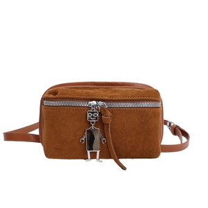 Brown faux suede crossbody bag featuring a silver metal robot charm and zipper closure