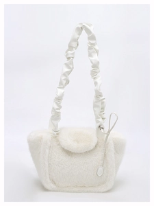 Detail of white faux fur shoulder bag with scrunched PU handle and teardrop pendant