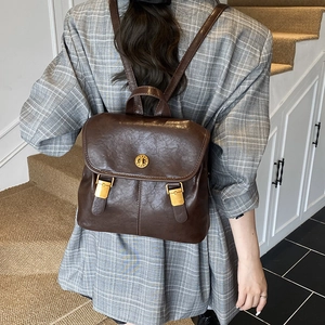 Vintage dark brown PU leather backpack with gold buckle closure for women's daily commute