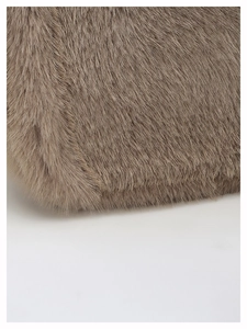 Close-up of the plush brown faux fur texture on this stylish luxury shoulder bag