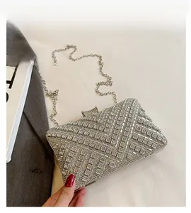 Detailed view of luxury silver rhinestone evening clutch with elegant geometric patterns