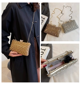 Detailed view of rhinestone evening clutch with chain strap and interior storage space