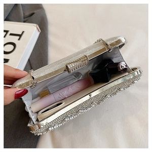 Interior view of silver rhinestone evening clutch bag showing space for cosmetics