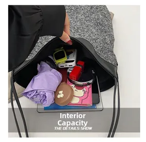 Top view of spacious interior of grey wool tote bag showing storage for iPad and essentials