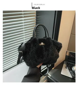 Detail of black plush bucket bag showing soft faux fur texture and metal buckle