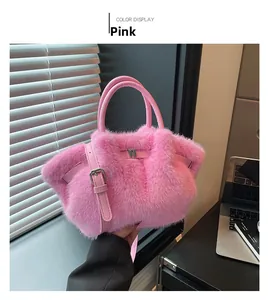 Pink faux fur bucket bag detail showing soft plush texture and adjustable leather strap