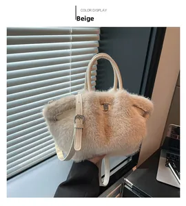 Macro detail of beige faux fur handbag with synthetic leather handle and metallic clasp