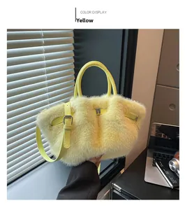 Detail of yellow plush handbag showing soft texture and silver buckle in natural light