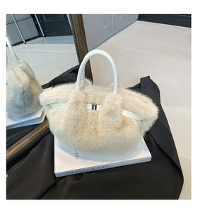 Detail of plush faux fur handbag in cream white with premium leather handle and metal buckle