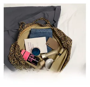 Top view of spacious leopard print tote bag interior showing large capacity and khaki lining