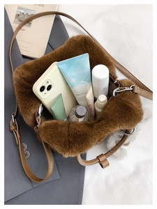 Detailed interior of brown plush crossbody bag showing spacious capacity for cosmetics