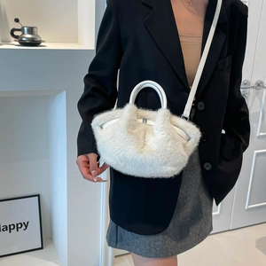 Winter plush crossbody bag in white faux fur with leather handle and adjustable strap