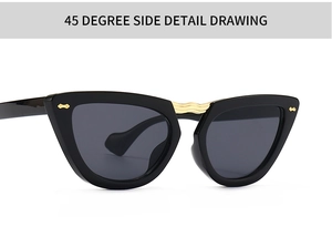 Dettaglio occhiali da sole cat eye a 45 gradi con ponte dorato e rivetti decorativi
