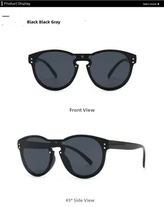 Detaillierte Vorder- und Seitenansicht der schwarzen Oversize-Sonnenbrille mit Nieten