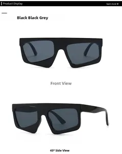 Front and side view of black oversized irregular sunglasses with grey lenses