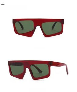 Flat top red transparent sunglasses with green lenses shown in front and side views