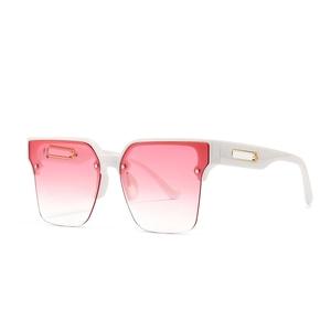 White wide frame sunglasses with pink gradient lenses and gold hollow metal detail