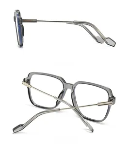 Detail view showing side and back of transparent grey square frame glasses with metal temples