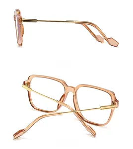 Side and back view of stylish tea-colored large frame glasses with golden metal temples