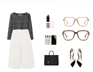 Flat lay of stylish oversized glasses paired with a chic women's clothing set and accessories