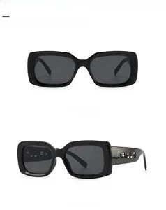 Front and 45-degree side view of black rectangular frame sunglasses with tinted lenses