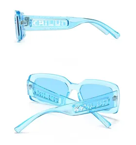 Detail view of ice blue translucent square sunglasses with embossed side logo