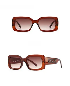 Detail of square frame sunglasses with gradient tan lenses and hollowed temple design