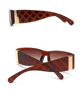 Detail view of tortoiseshell sunglasses featuring quilted texture and gold metal accents