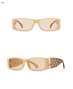 Detailed view of beige rectangular sunglasses featuring woven pattern on the temples